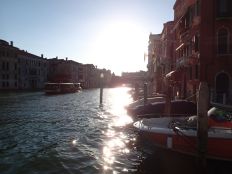 sun gleaming over the azure waters of Venice